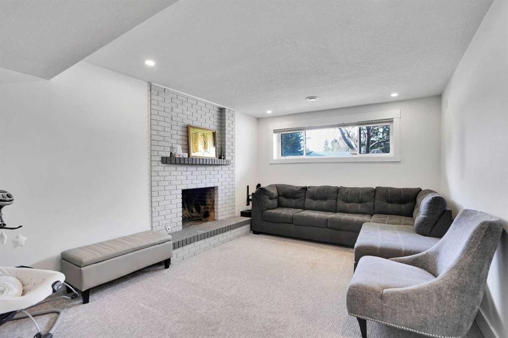 5702 Brenner Crescent Nw, Calgary, AB - Indoor Photo Showing Living Room With Fireplace