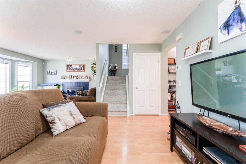 198 Somerside Park Sw, Calgary, AB - Indoor Photo Showing Other Room With Fireplace