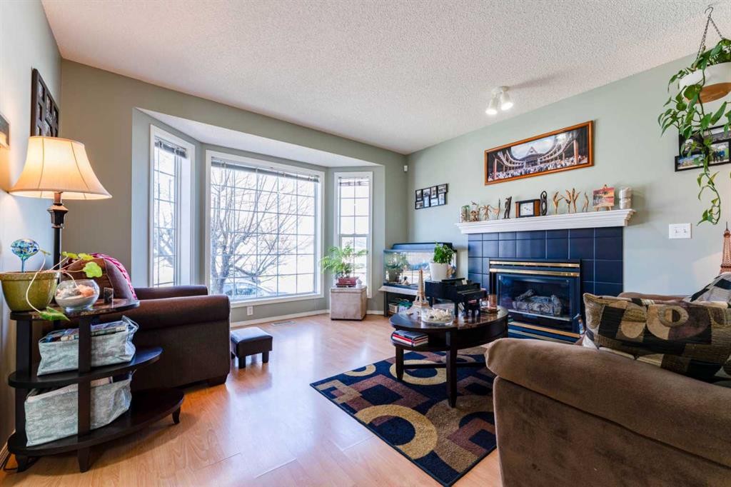 198 Somerside Park Sw, Calgary, AB - Indoor Photo Showing Living Room With Fireplace