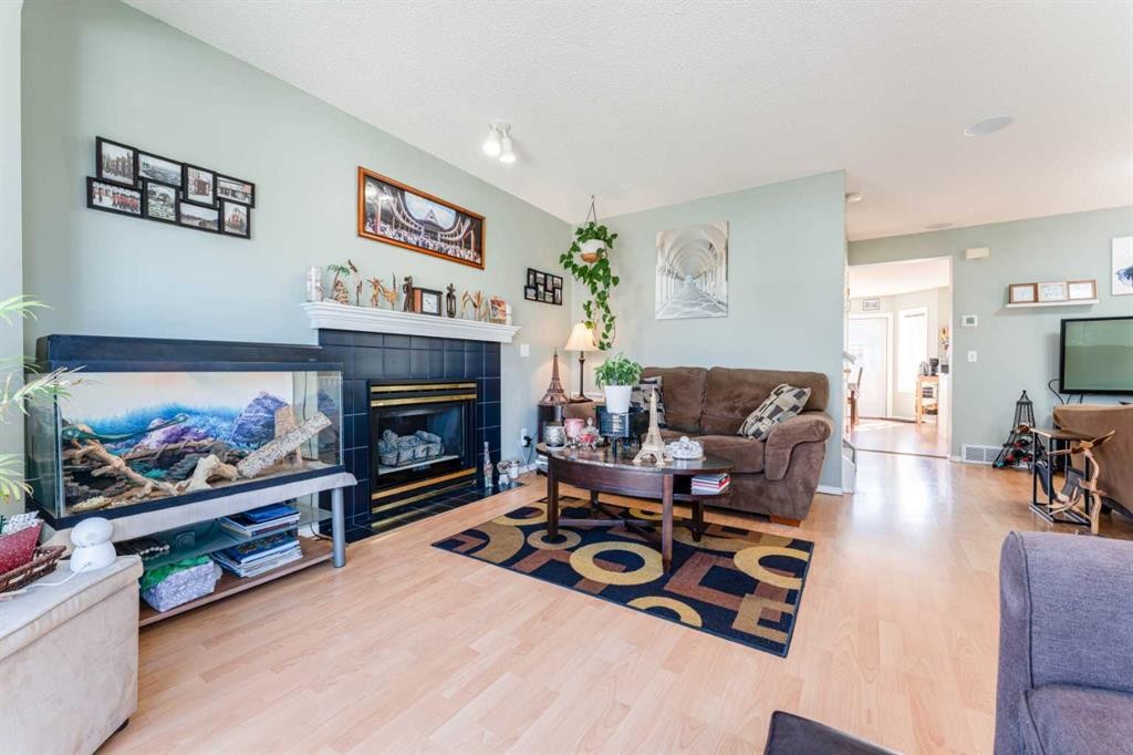 198 Somerside Park Sw, Calgary, AB - Indoor Photo Showing Living Room With Fireplace