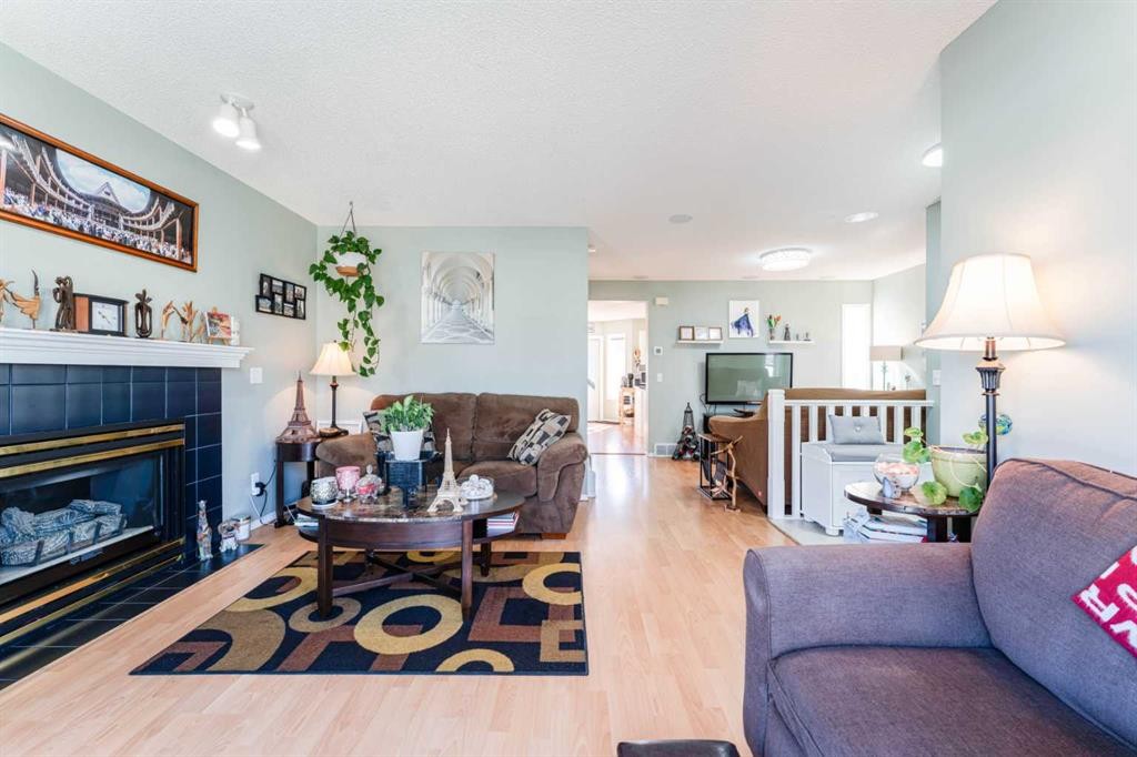 198 Somerside Park Sw, Calgary, AB - Indoor Photo Showing Living Room With Fireplace