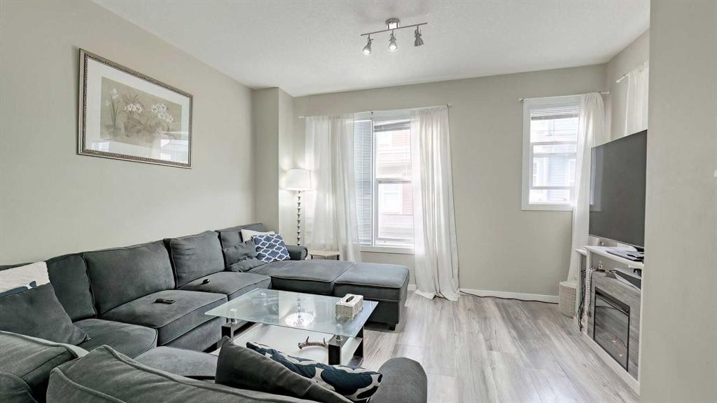 54 New Brighton Point Se, Calgary, AB - Indoor Photo Showing Living Room