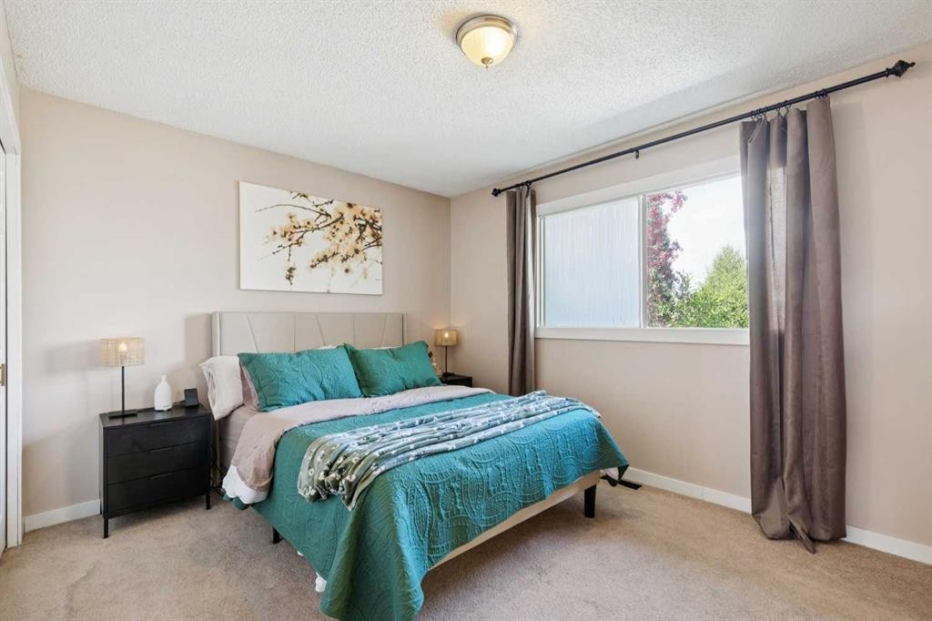 56 Riverbrook Road Se, Calgary, AB - Indoor Photo Showing Bedroom