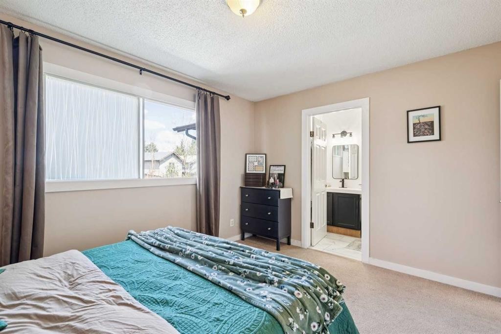 56 Riverbrook Road Se, Calgary, AB - Indoor Photo Showing Bedroom
