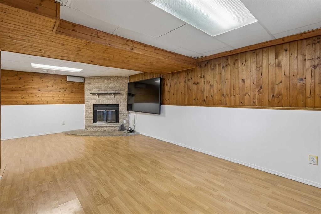 83 Appletree Close Se, Calgary, AB - Indoor Photo Showing Other Room With Fireplace