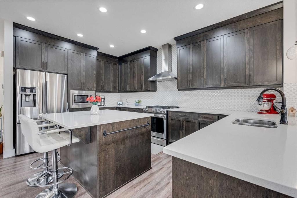 4 Legacy Court Se, Calgary, AB - Indoor Photo Showing Kitchen With Stainless Steel Kitchen With Double Sink With Upgraded Kitchen