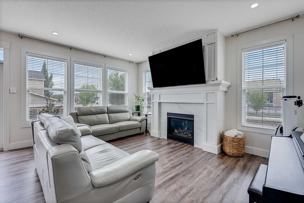 4 Legacy Court Se, Calgary, AB - Indoor Photo Showing Living Room With Fireplace