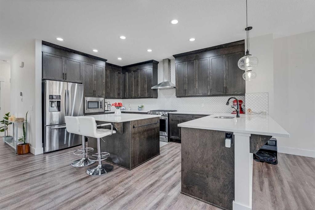 4 Legacy Court Se, Calgary, AB - Indoor Photo Showing Kitchen With Stainless Steel Kitchen With Upgraded Kitchen
