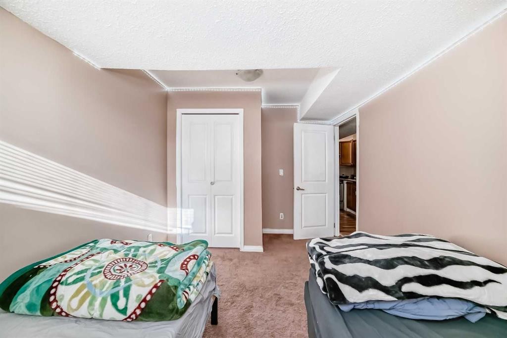 36 Saddleland Court Ne, Calgary, AB - Indoor Photo Showing Bedroom
