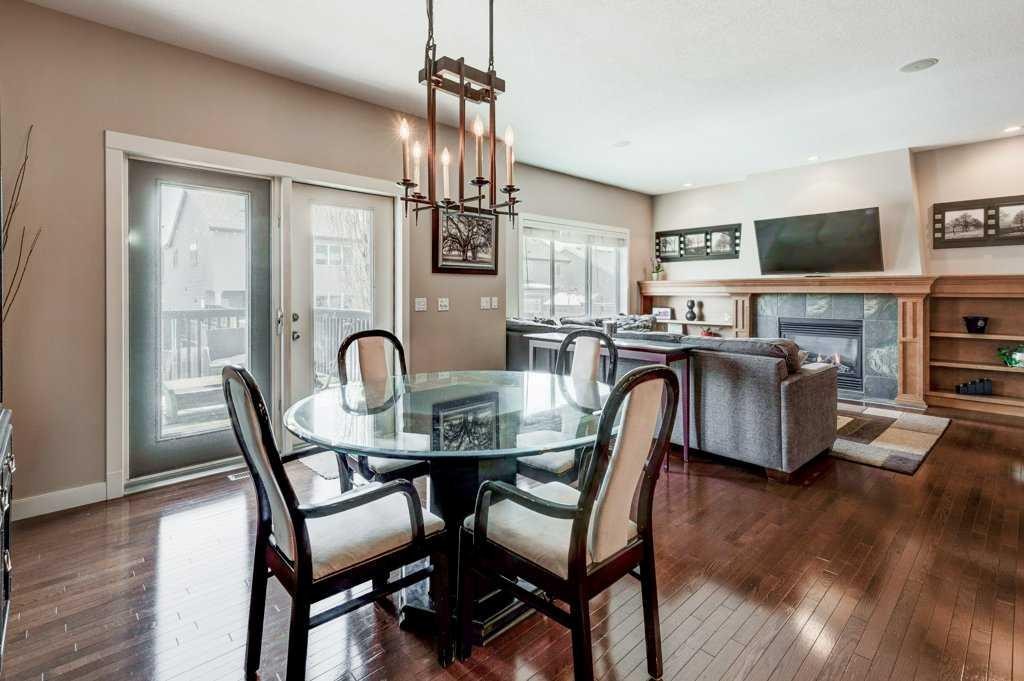 88 Copperstone Gate Se, Calgary, AB - Indoor Photo Showing Dining Room With Fireplace