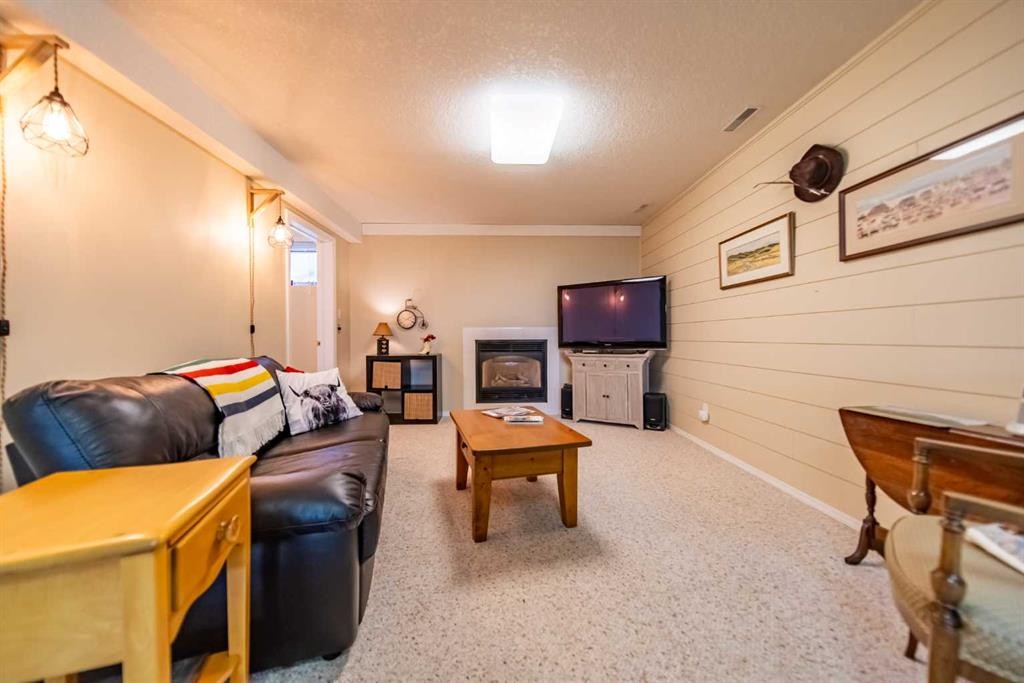 76 Sunset Crescent, Okotoks, AB - Indoor With Fireplace