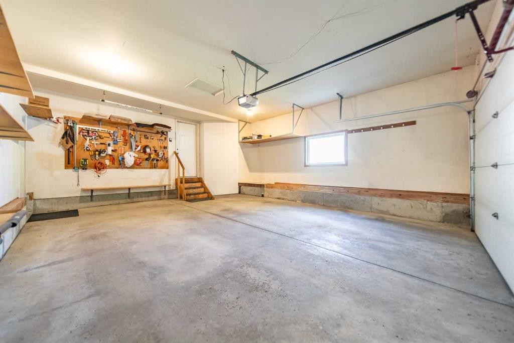 76 Sunset Crescent, Okotoks, AB - Indoor Photo Showing Garage
