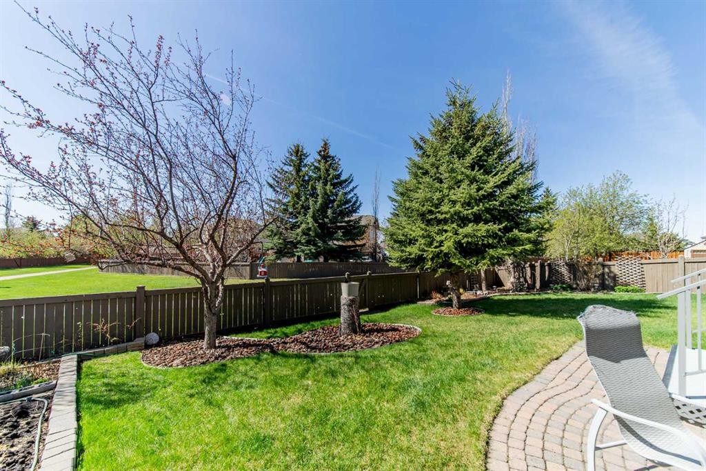76 Sunset Crescent, Okotoks, AB - Outdoor With Backyard