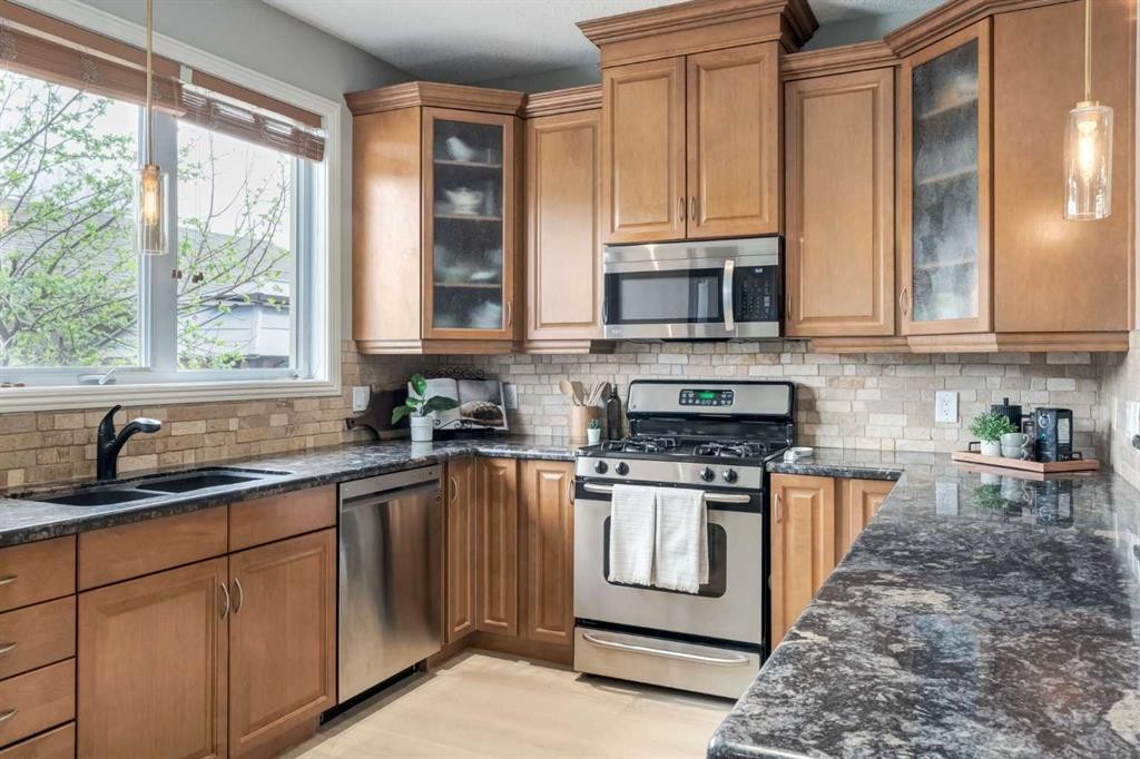 3117 Don Ethell Boulevard Sw, Calgary, AB - Indoor Photo Showing Kitchen With Double Sink