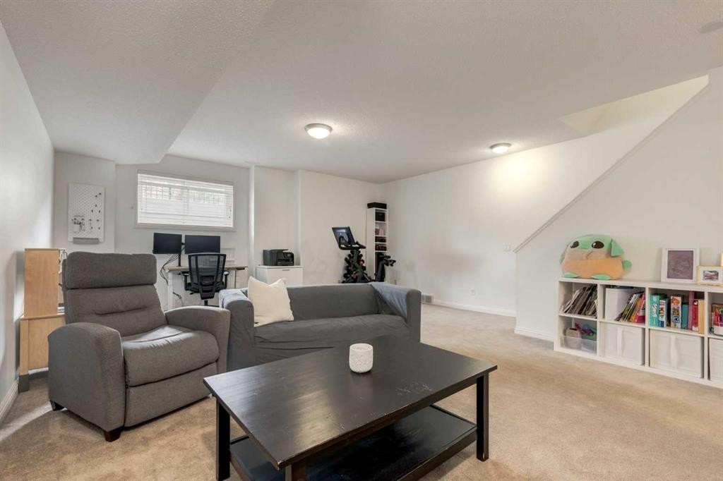 3117 Don Ethell Boulevard Sw, Calgary, AB - Indoor Photo Showing Living Room