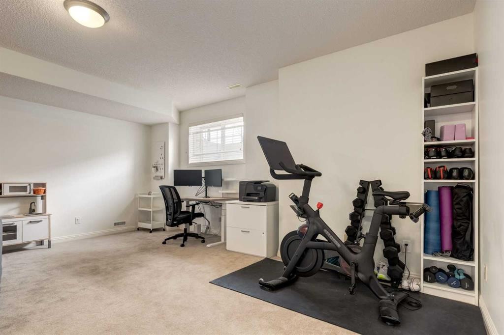 3117 Don Ethell Boulevard Sw, Calgary, AB - Indoor Photo Showing Gym Room