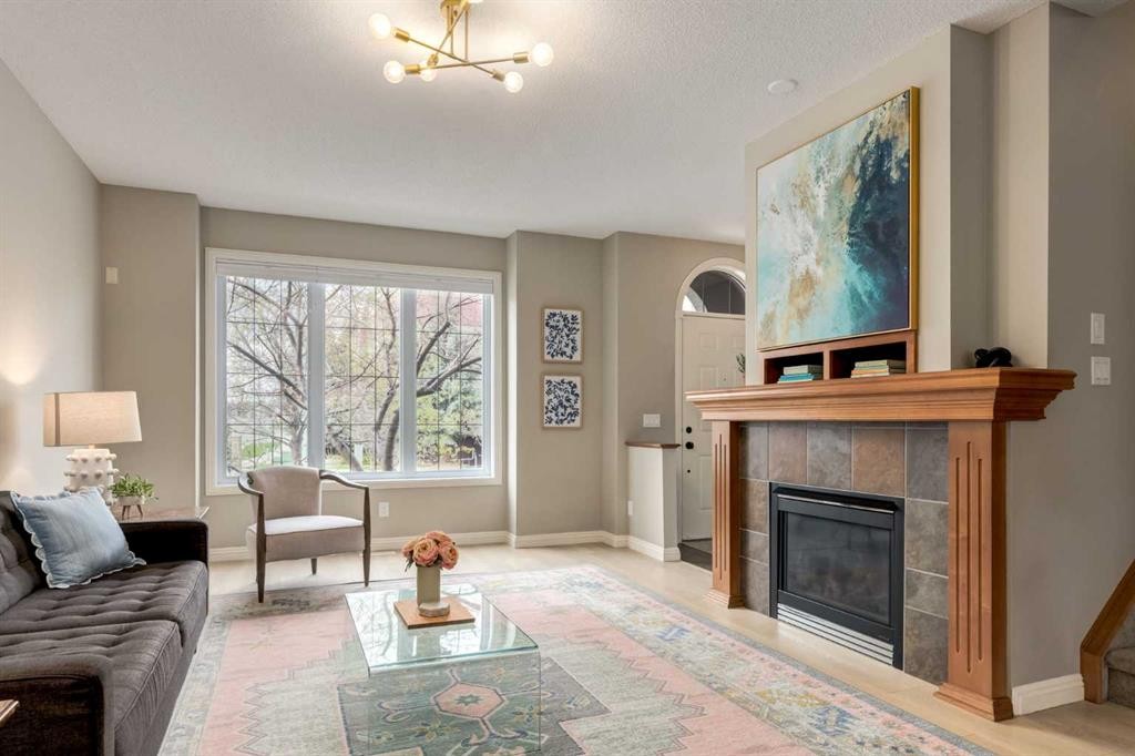 3117 Don Ethell Boulevard Sw, Calgary, AB - Indoor Photo Showing Living Room With Fireplace