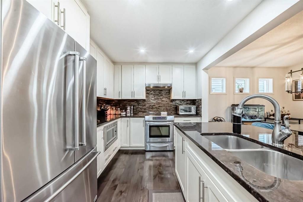 144 Copperpond Parade Se, Calgary, AB - Indoor Photo Showing Kitchen With Stainless Steel Kitchen With Double Sink With Upgraded Kitchen