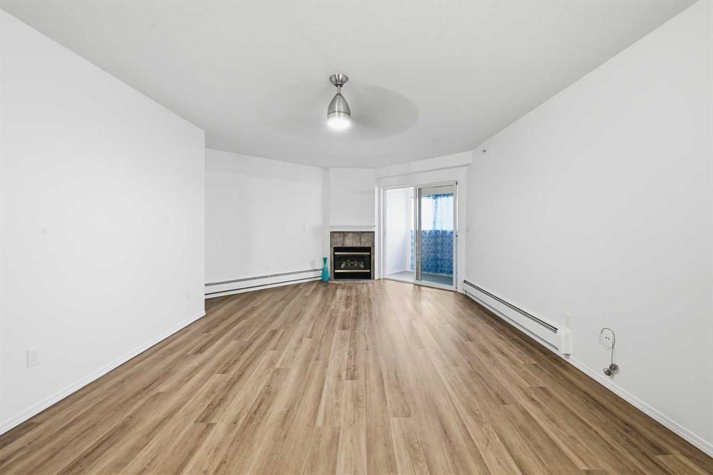 439-165 Manora Place Ne, Calgary, AB - Indoor With Fireplace