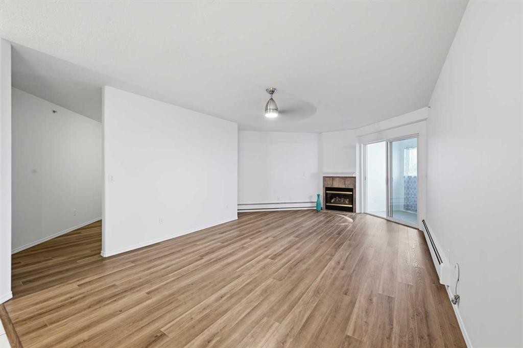 439-165 Manora Place Ne, Calgary, AB - Indoor With Fireplace