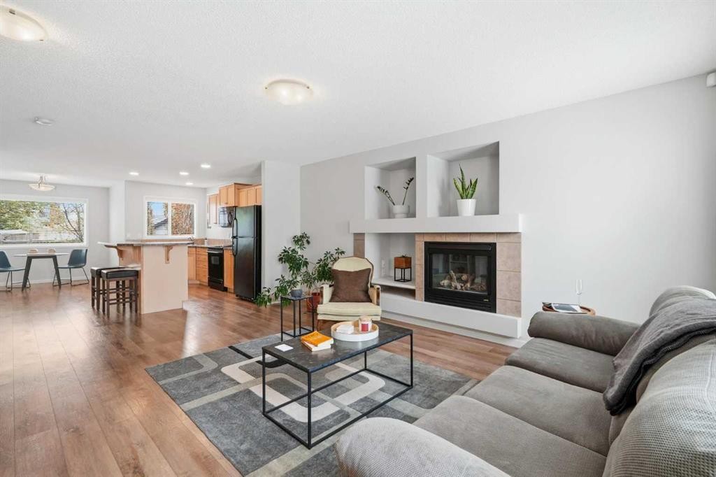 29 Copperfield Heath Se, Calgary, AB - Indoor Photo Showing Living Room With Fireplace