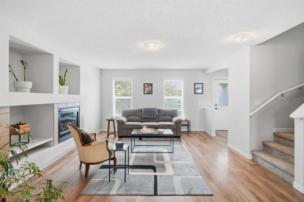 29 Copperfield Heath Se, Calgary, AB - Indoor Photo Showing Living Room With Fireplace