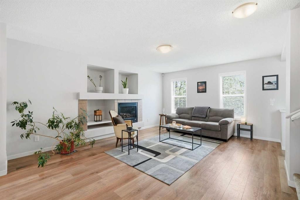 29 Copperfield Heath Se, Calgary, AB - Indoor Photo Showing Living Room With Fireplace