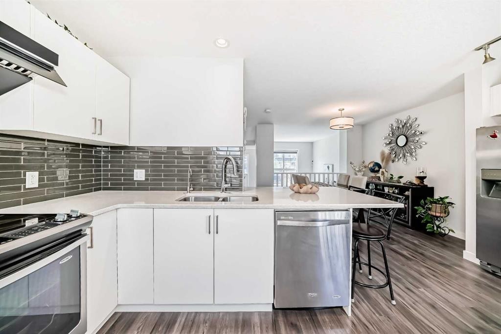 551 Evanston Link Nw, Calgary, AB - Indoor Photo Showing Kitchen With Double Sink With Upgraded Kitchen