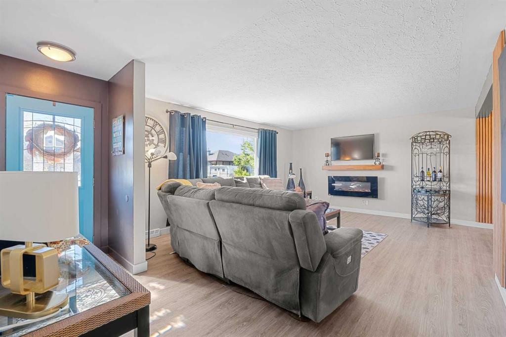 518B Highwood, Longview, AB - Indoor Photo Showing Living Room With Fireplace