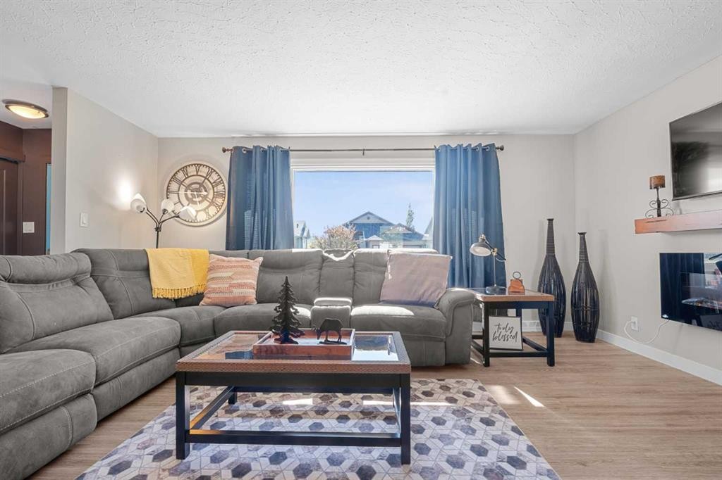 518B Highwood, Longview, AB - Indoor Photo Showing Living Room With Fireplace