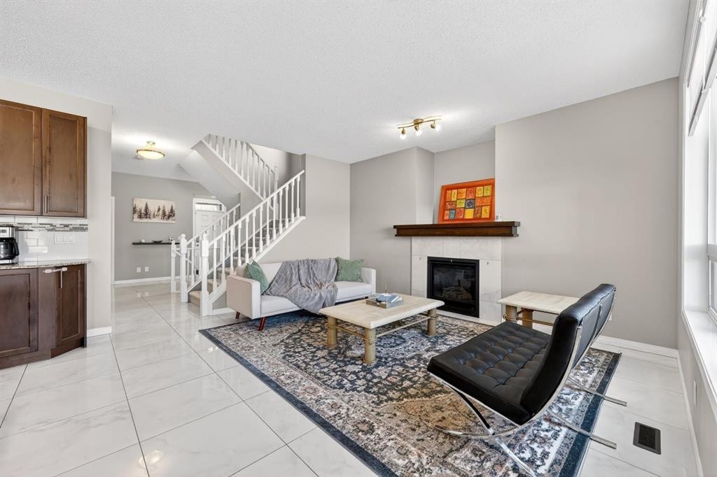71 Walden Manor Se, Calgary, AB - Indoor Photo Showing Other Room With Fireplace