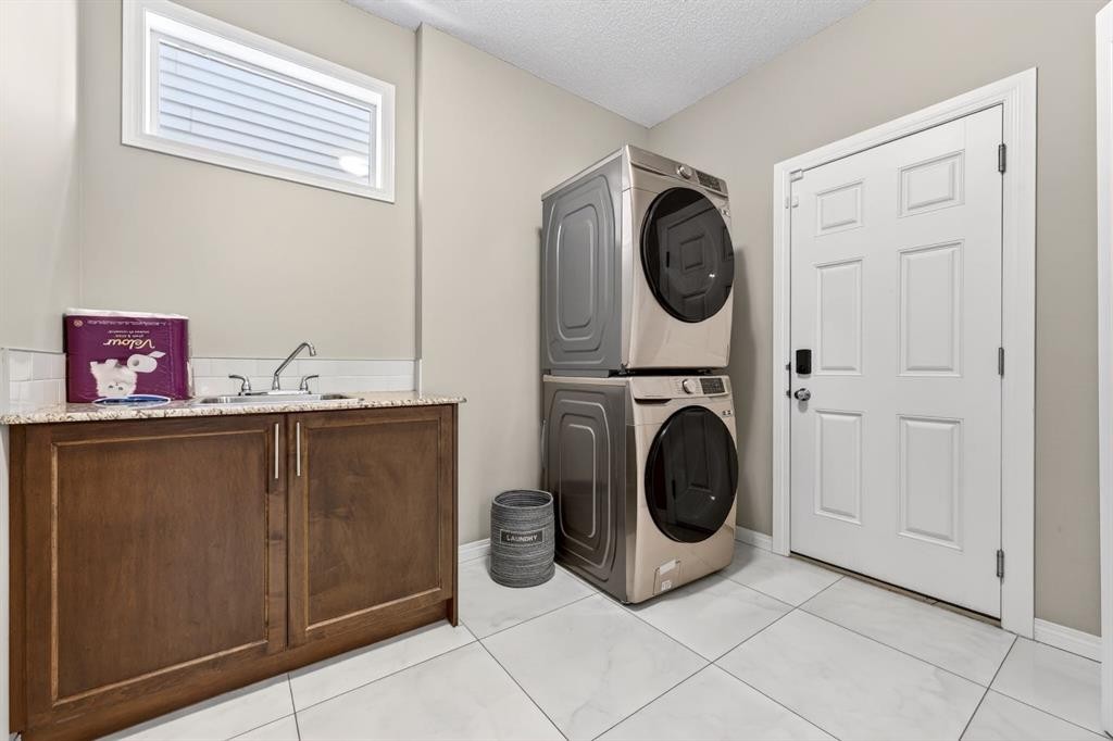 71 Walden Manor Se, Calgary, AB - Indoor Photo Showing Laundry Room