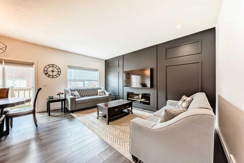 65 Saddlestone Green Ne, Calgary, AB - Indoor Photo Showing Living Room With Fireplace