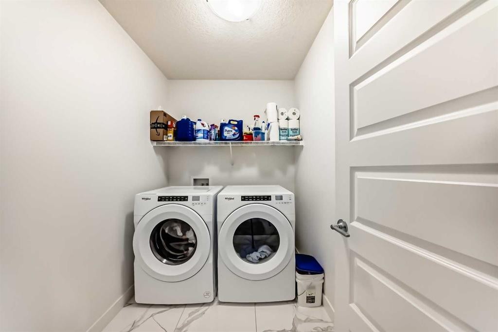 65 Saddlestone Green Ne, Calgary, AB - Indoor Photo Showing Laundry Room
