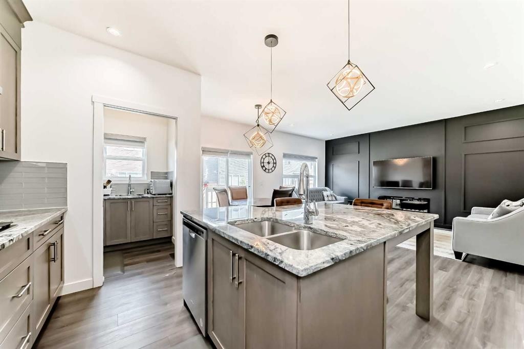 65 Saddlestone Green Ne, Calgary, AB - Indoor Photo Showing Kitchen With Double Sink With Upgraded Kitchen