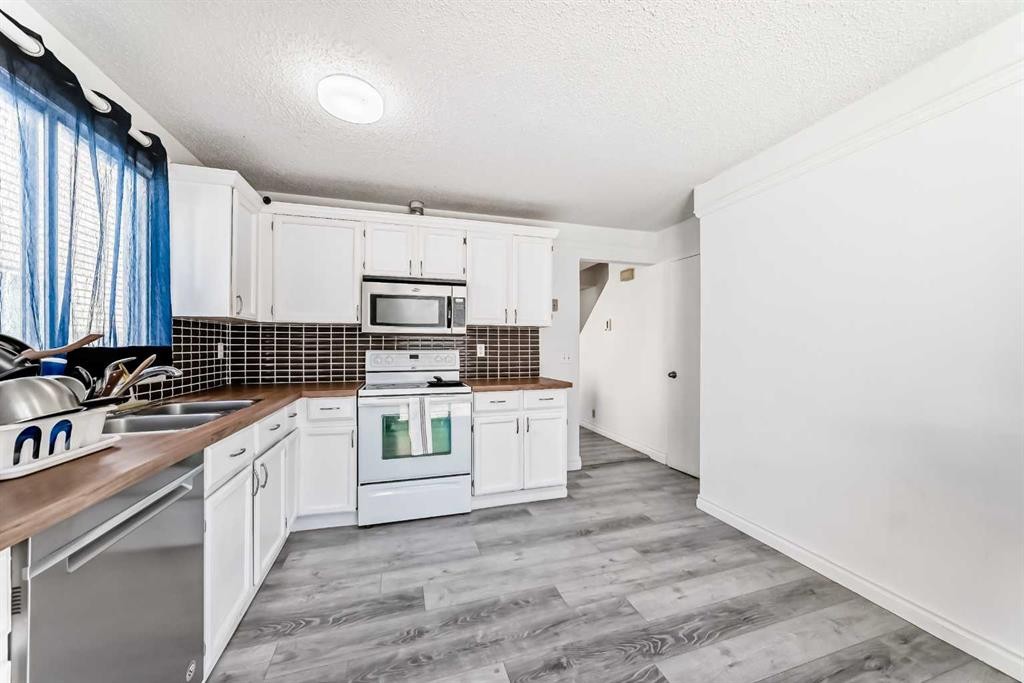 279 Falton Drive Ne, Calgary, AB - Indoor Photo Showing Kitchen With Double Sink