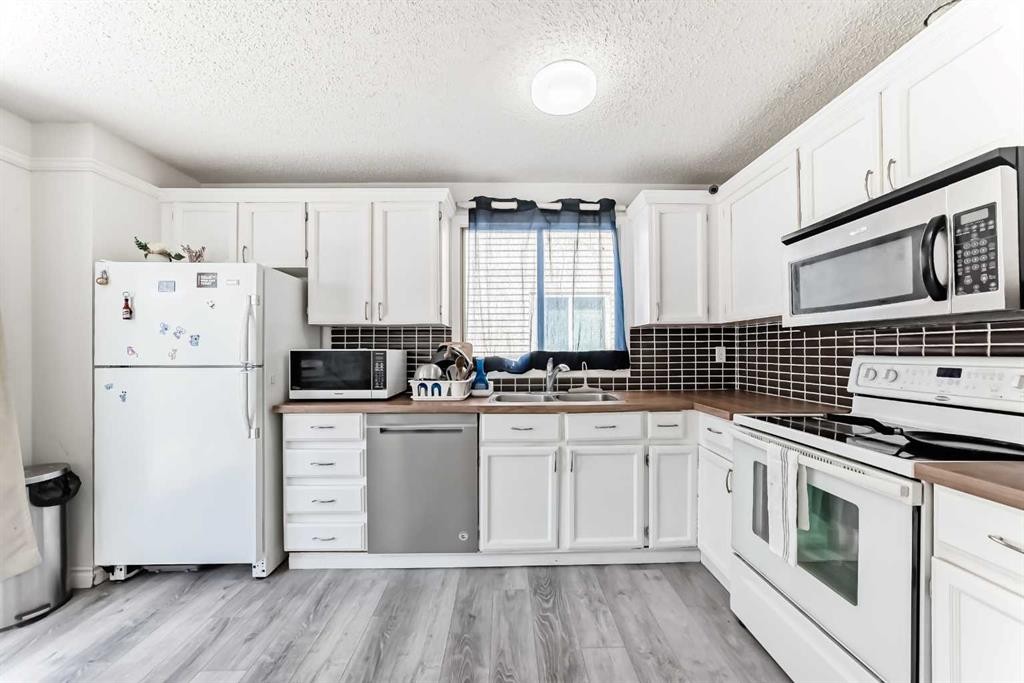 279 Falton Drive Ne, Calgary, AB - Indoor Photo Showing Kitchen With Double Sink