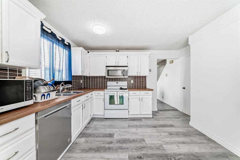 279 Falton Drive Ne, Calgary, AB - Indoor Photo Showing Kitchen With Double Sink