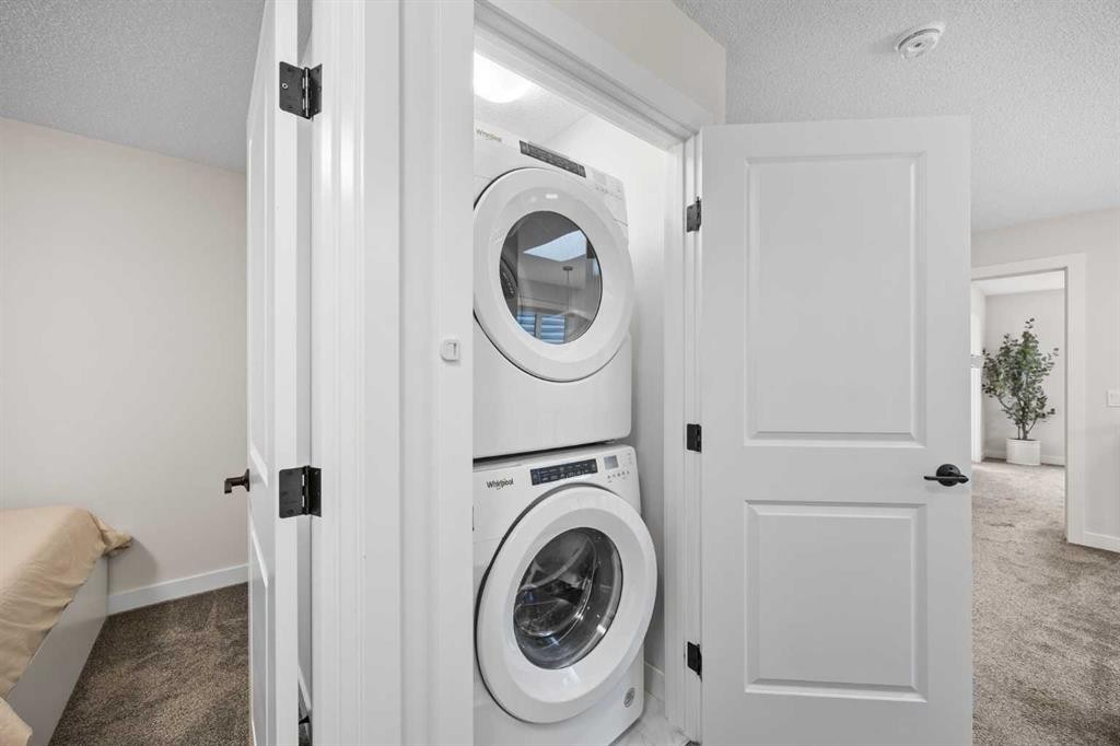 72 Seton Villas Se, Calgary, AB - Indoor Photo Showing Laundry Room