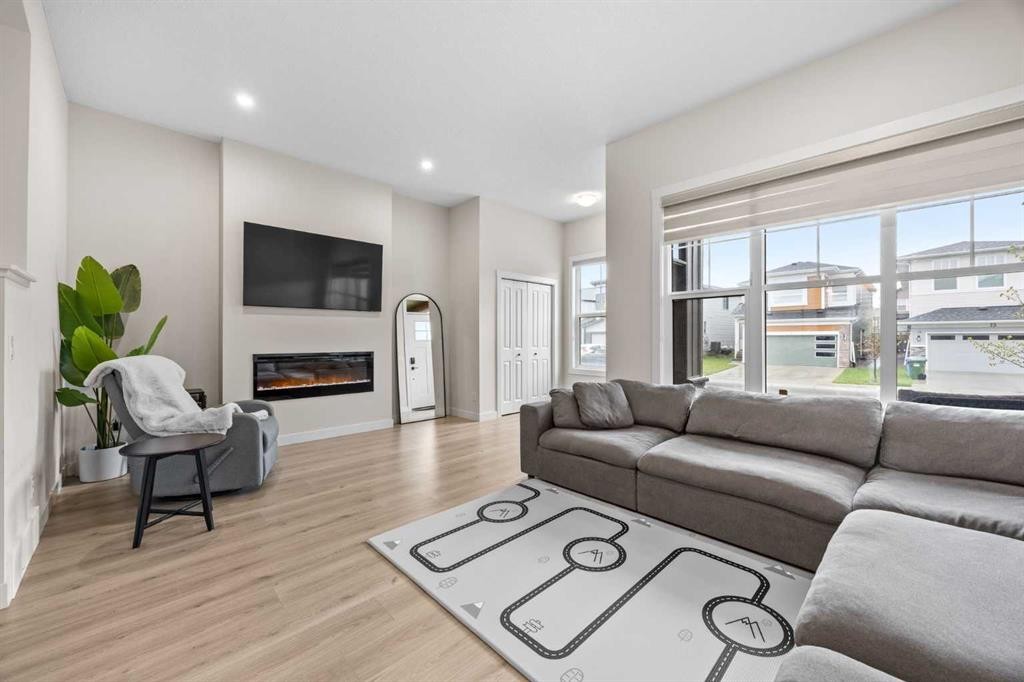 72 Seton Villas Se, Calgary, AB - Indoor Photo Showing Living Room With Fireplace