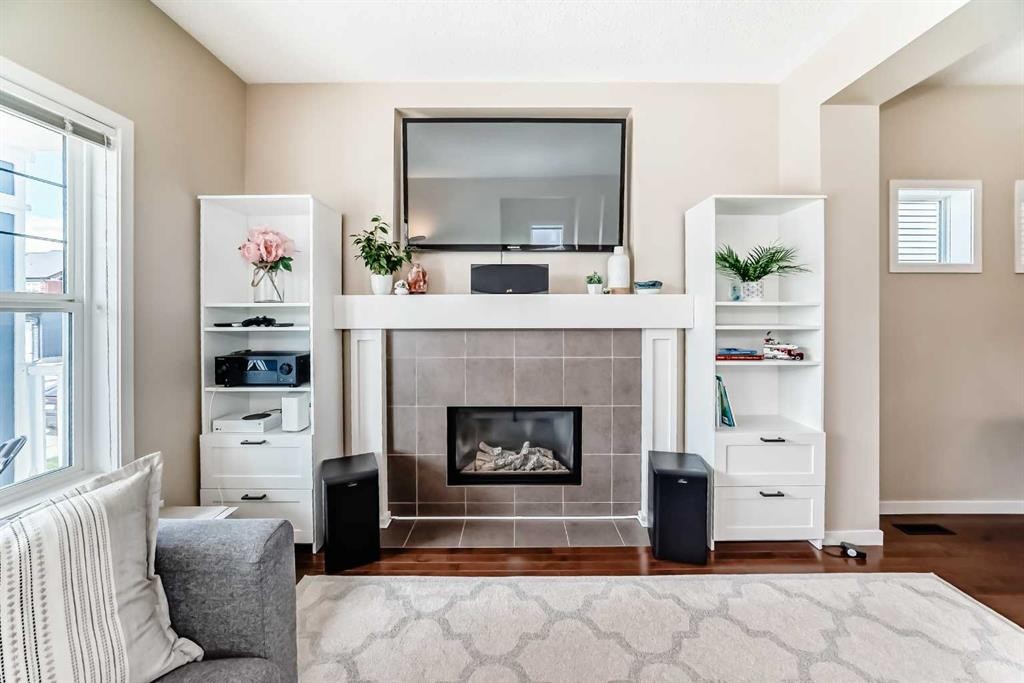 199 River Heights Green, Cochrane, AB - Indoor Photo Showing Living Room With Fireplace