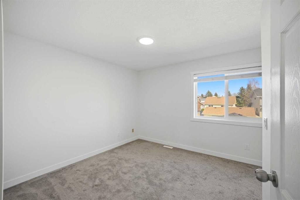 24 Martindale Drive Ne, Calgary, AB - Indoor Photo Showing Other Room