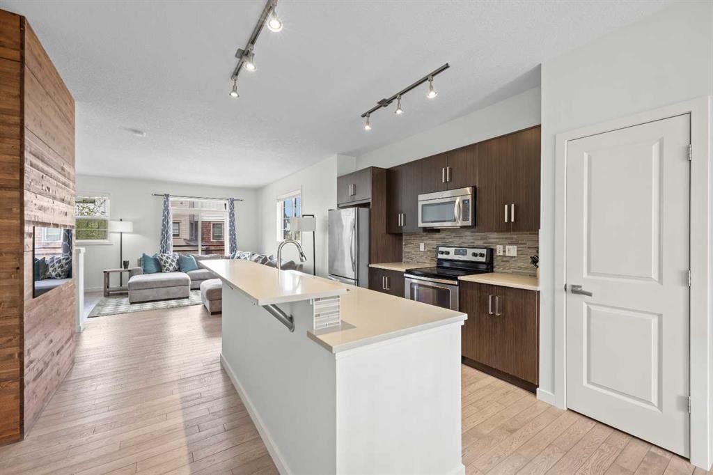 134 Walden Circle Se, Calgary, AB - Indoor Photo Showing Kitchen With Fireplace With Upgraded Kitchen