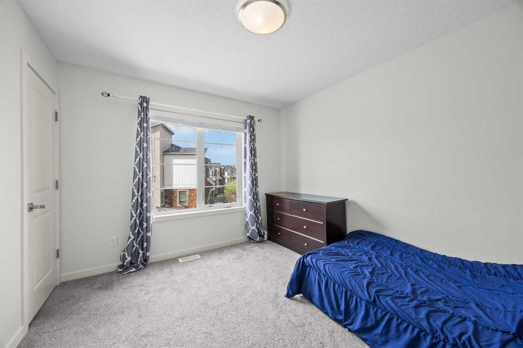 134 Walden Circle Se, Calgary, AB - Indoor Photo Showing Bedroom