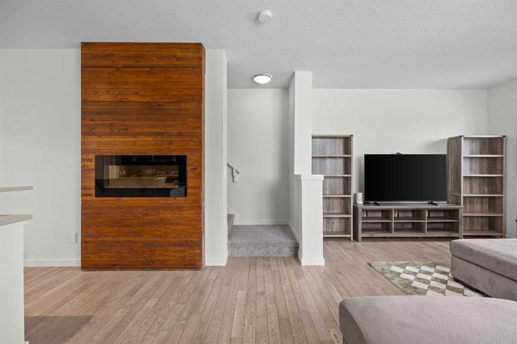 134 Walden Circle Se, Calgary, AB - Indoor Photo Showing Living Room With Fireplace