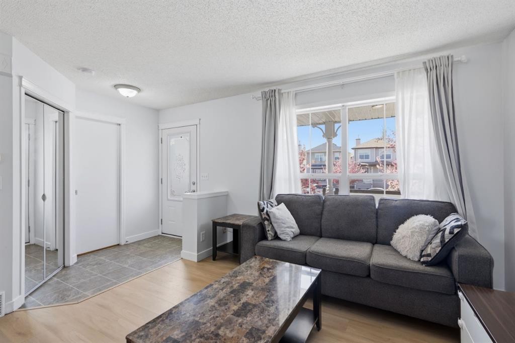 80 Prestwick Bay Se, Calgary, AB - Indoor Photo Showing Living Room