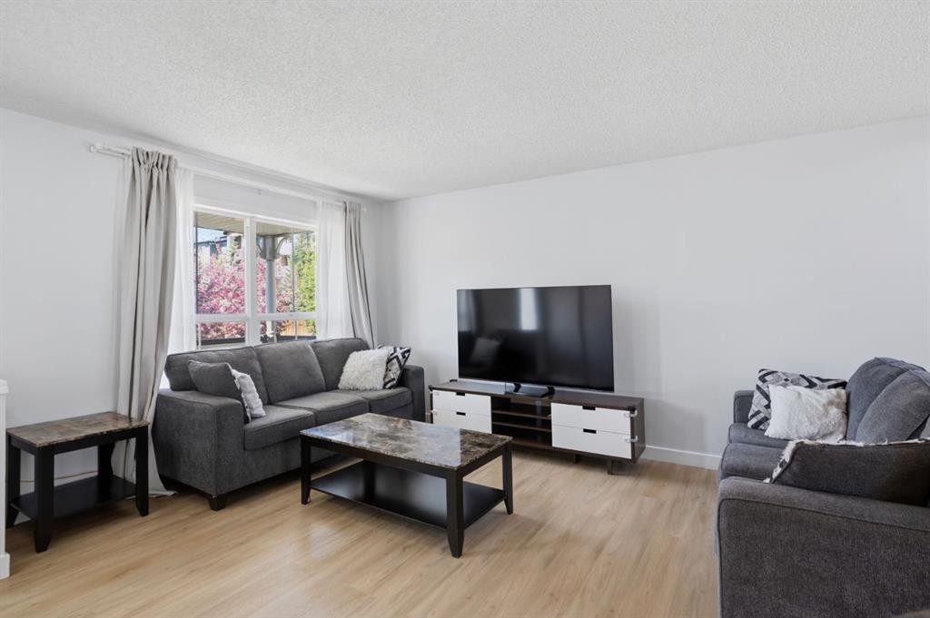 80 Prestwick Bay Se, Calgary, AB - Indoor Photo Showing Living Room