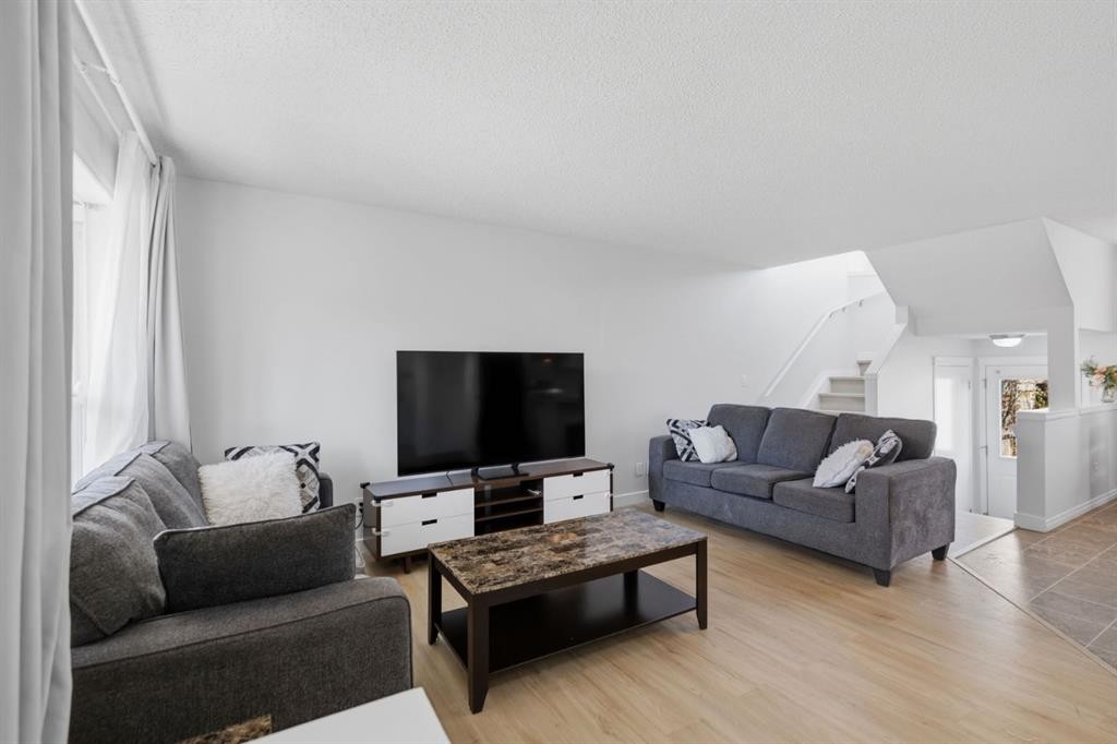 80 Prestwick Bay Se, Calgary, AB - Indoor Photo Showing Living Room