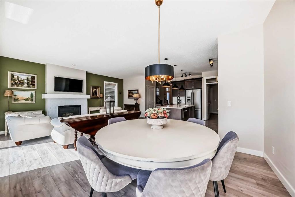 39 Sage Bluff Mews Nw, Calgary, AB - Indoor Photo Showing Dining Room With Fireplace