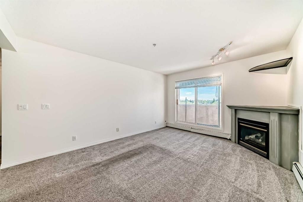317-649 Marsh Road Ne, Calgary, AB - Indoor With Fireplace